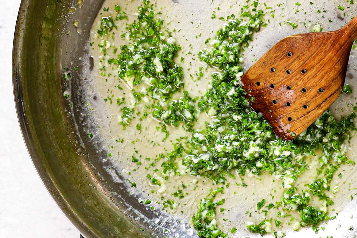 showing how to make Cajun shrimp recipe by sautรฉing garlic in butter, then adding parsley and lemon juice