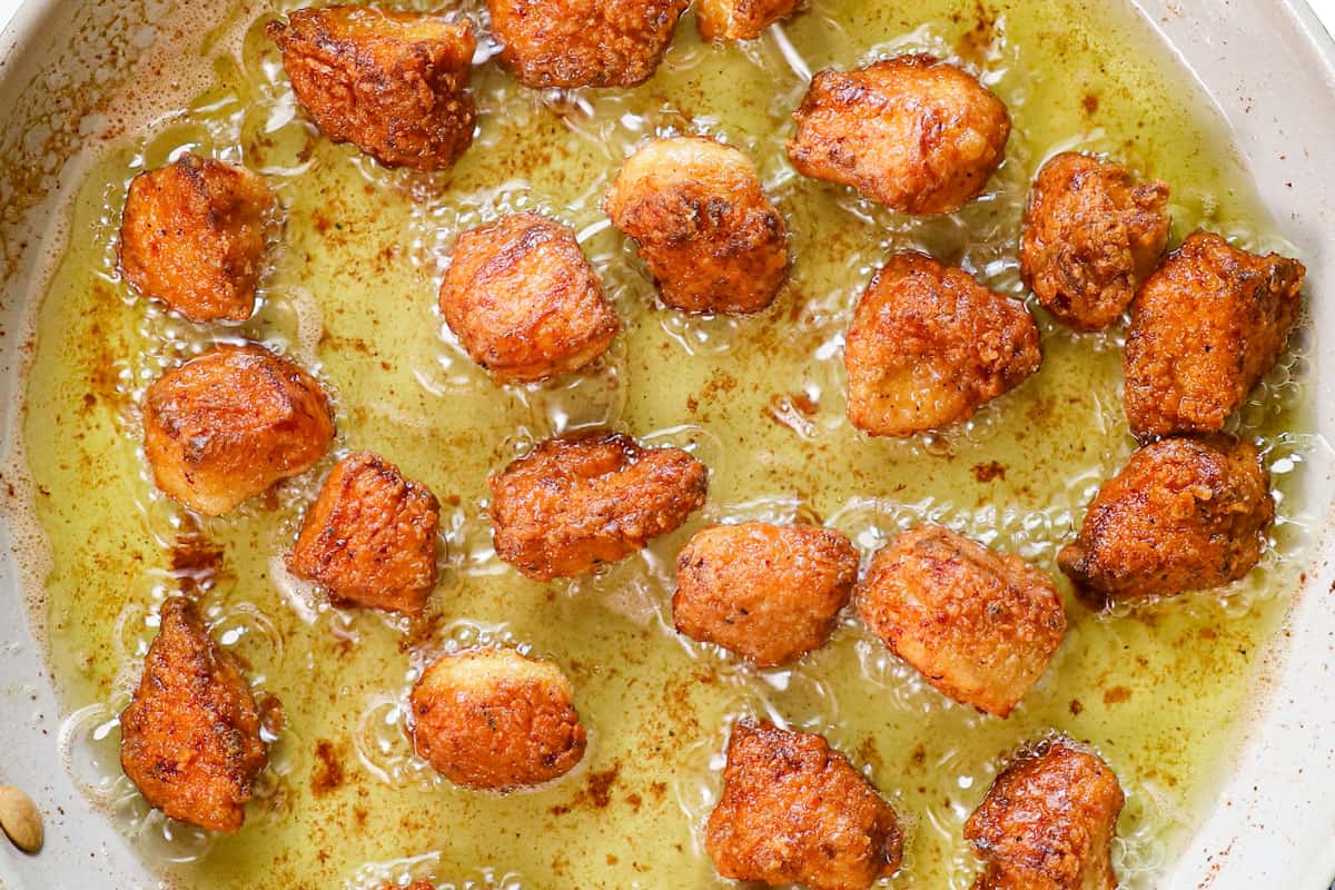 a collage showing how to make Korean fried chicken (yangnyeom) by frying the chicken in a pan