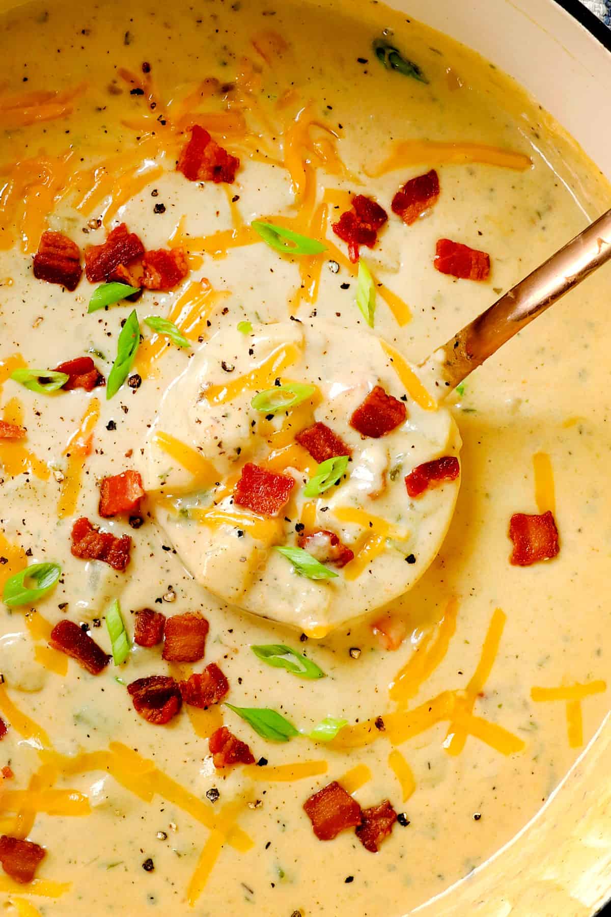 top view of best best potato soup recipe with a ladle spooning the soup