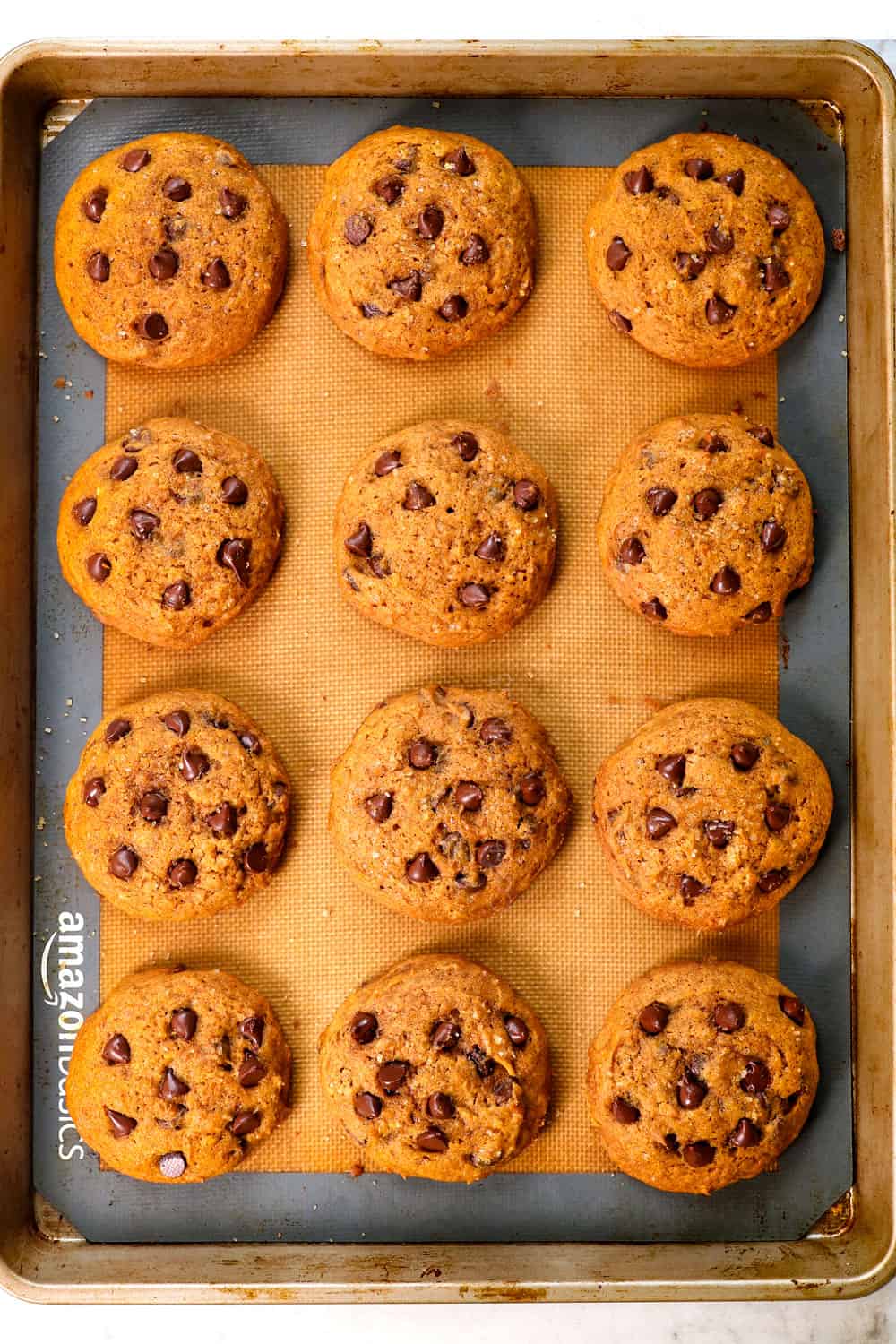 showing how to make pumpkin chocolate chip cookies by baking the cookies until a toothpick comes out clean