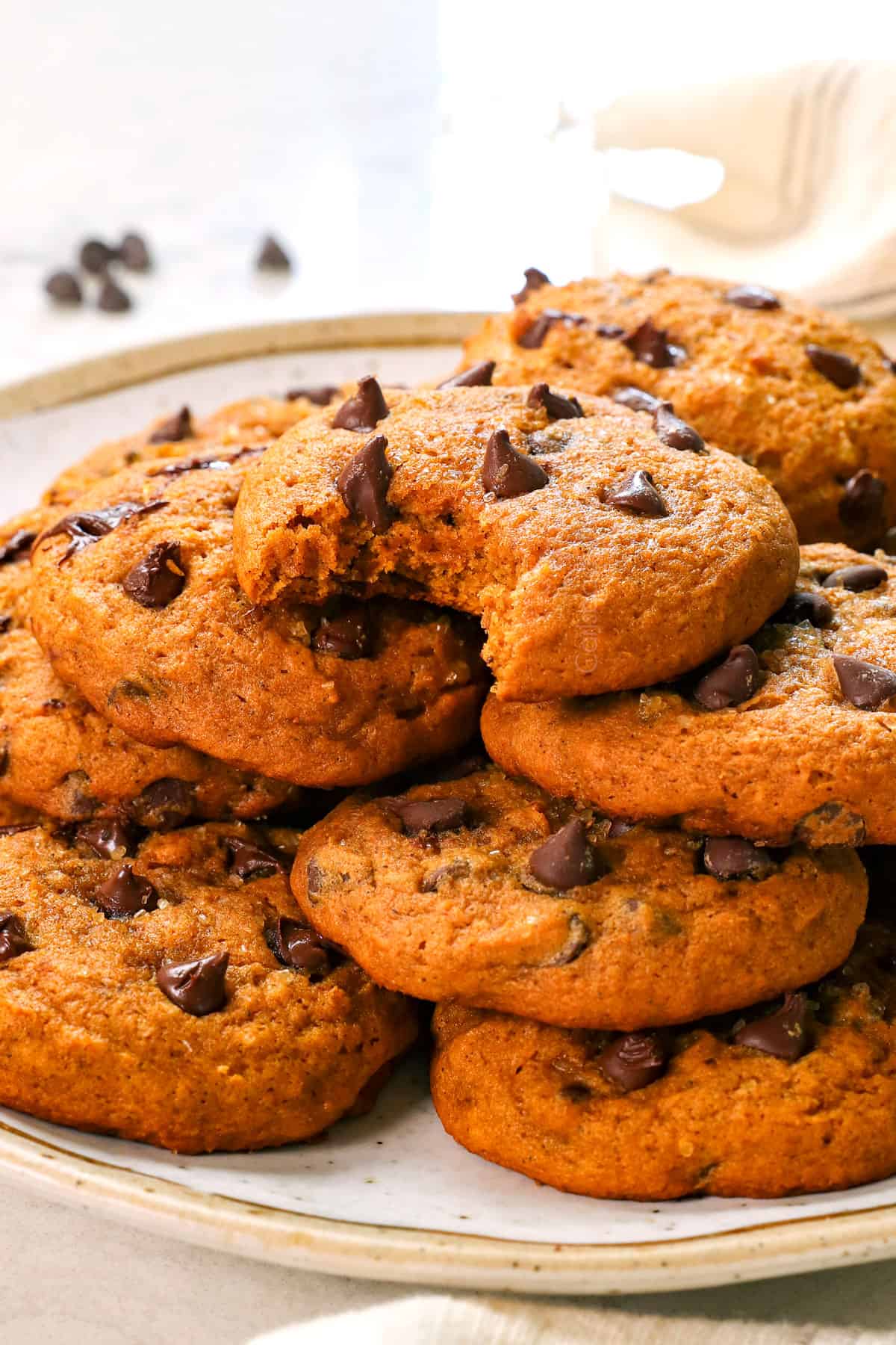 serving chocolate chip pumpkin cookies on a plate
