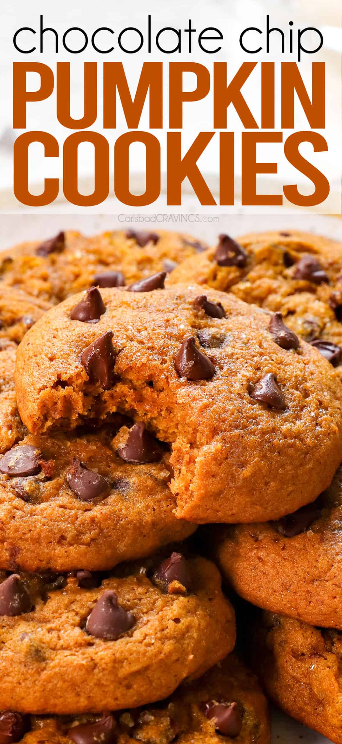 up close of pumpkin chocolate chip cookies with a bite taken out showing how soft the cookies are