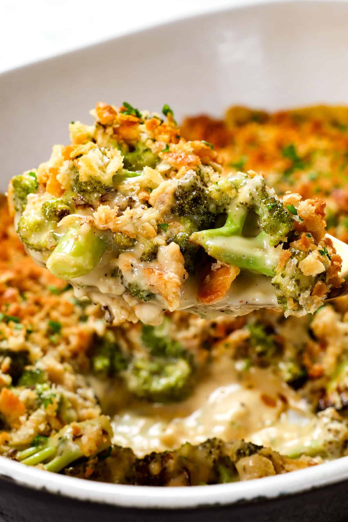 scooping up broccoli casserole recipe with a spoon