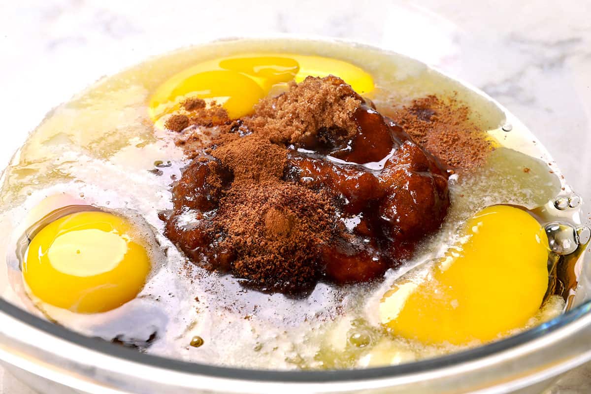 showing how to make chocolate pecan pie by whisking eggs, corn syrup and brown sugar together