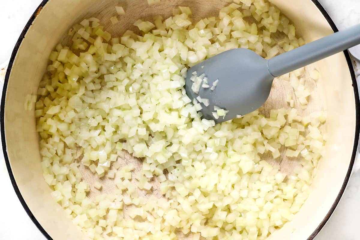 showing how to make Split Pea Soup recipe by sautรฉing onions until softened