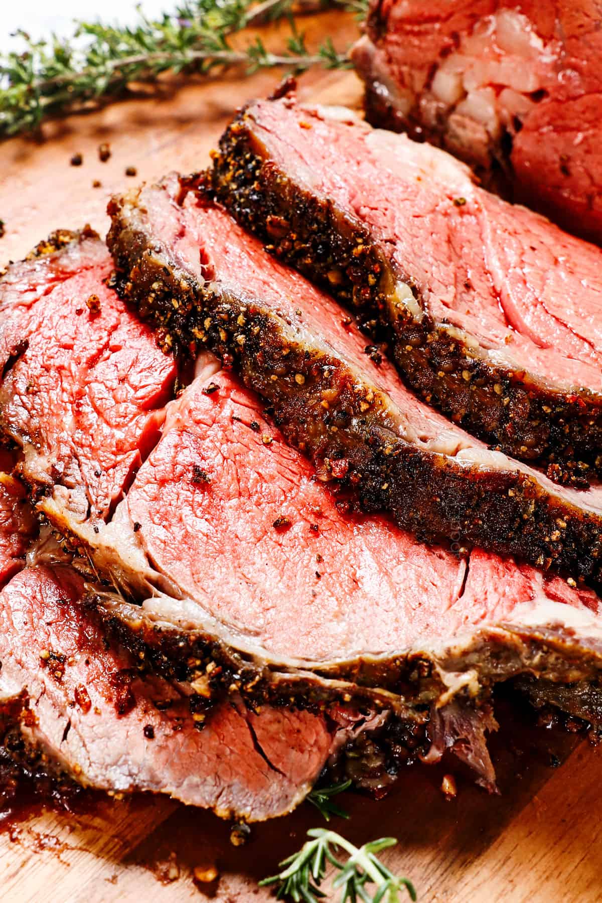 up close of slices of prime rib recipe showing the pepper crust