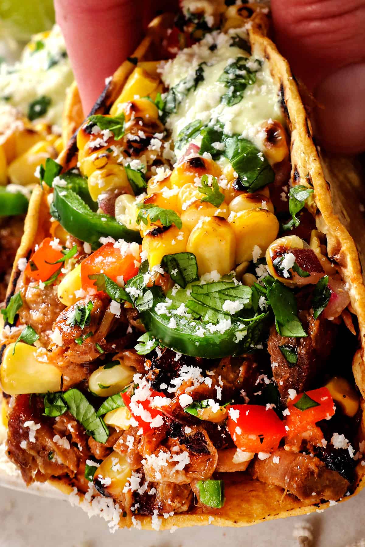 up close of carnitas taco showing how juicy the carnitas are