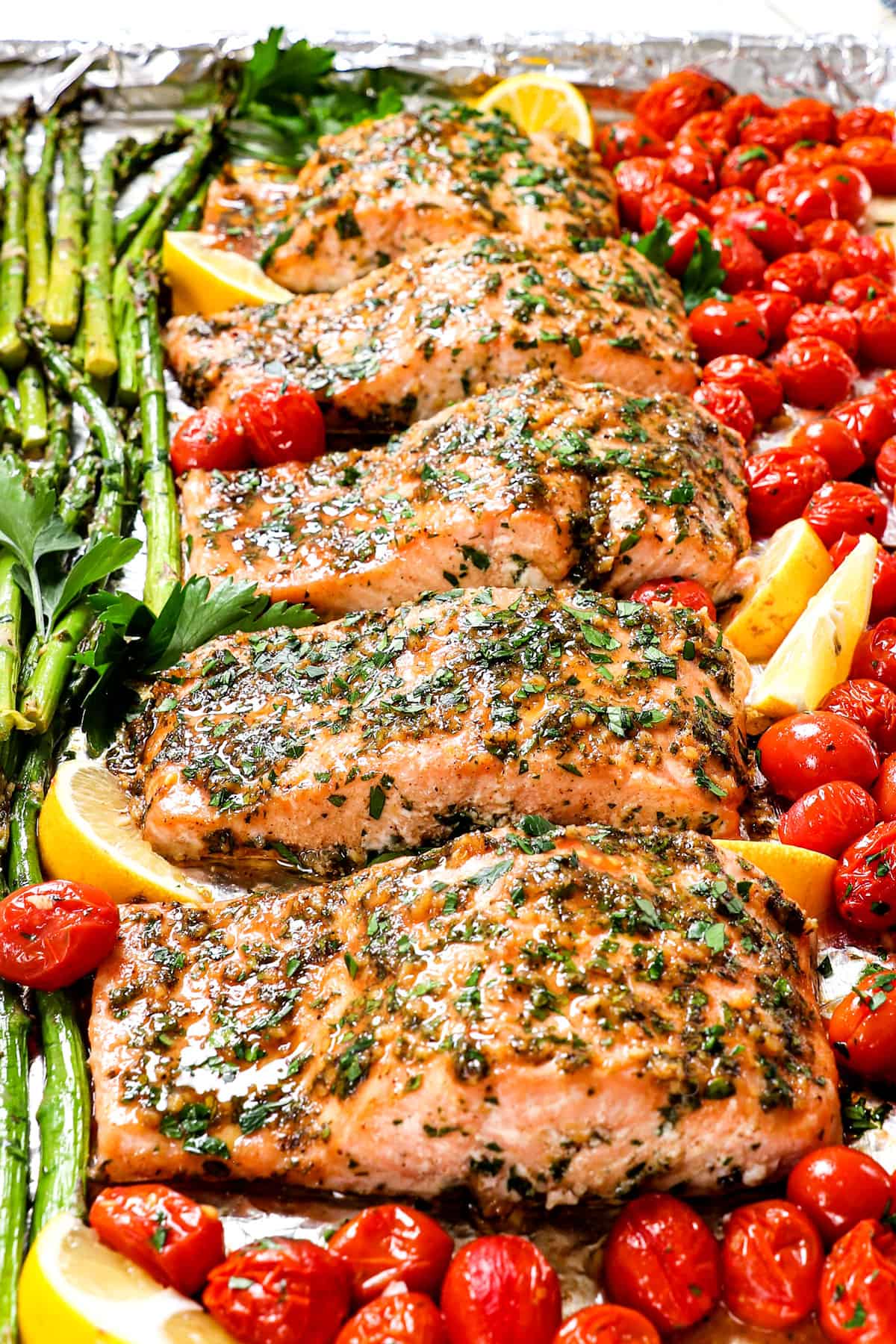 showing oven baked salmon on a baking sheet