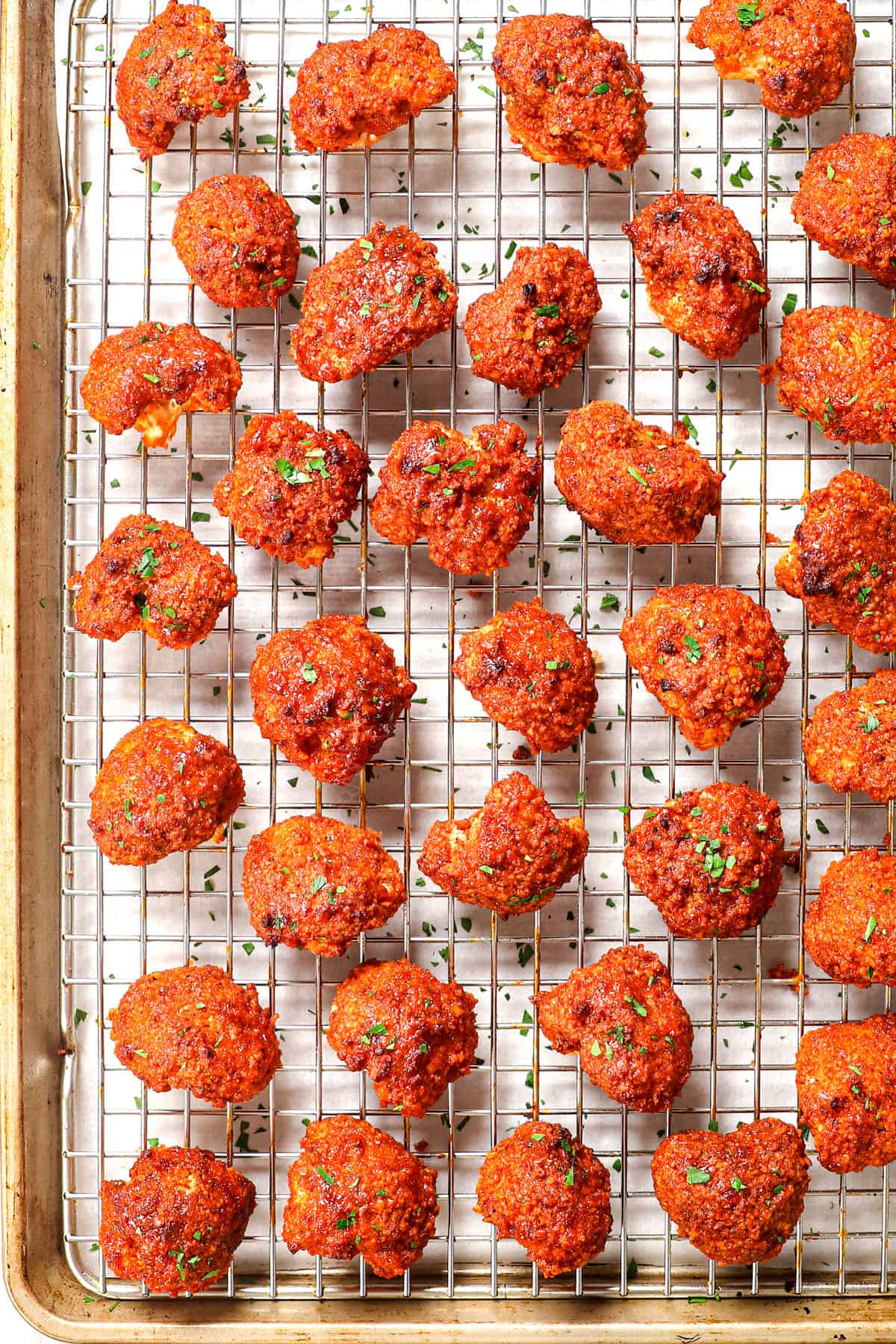 showing how to make buffalo cauliflower by baking until crispy