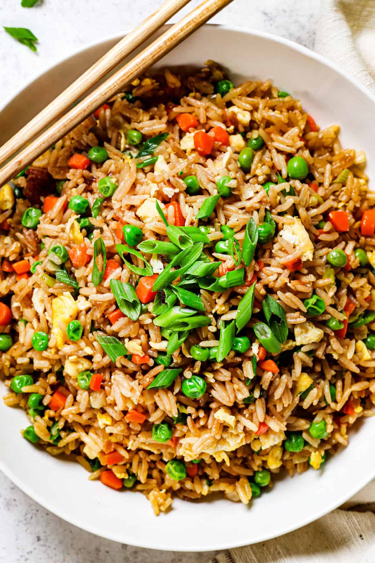 showing how to eat easy fried rice in a bowl with chopsticks