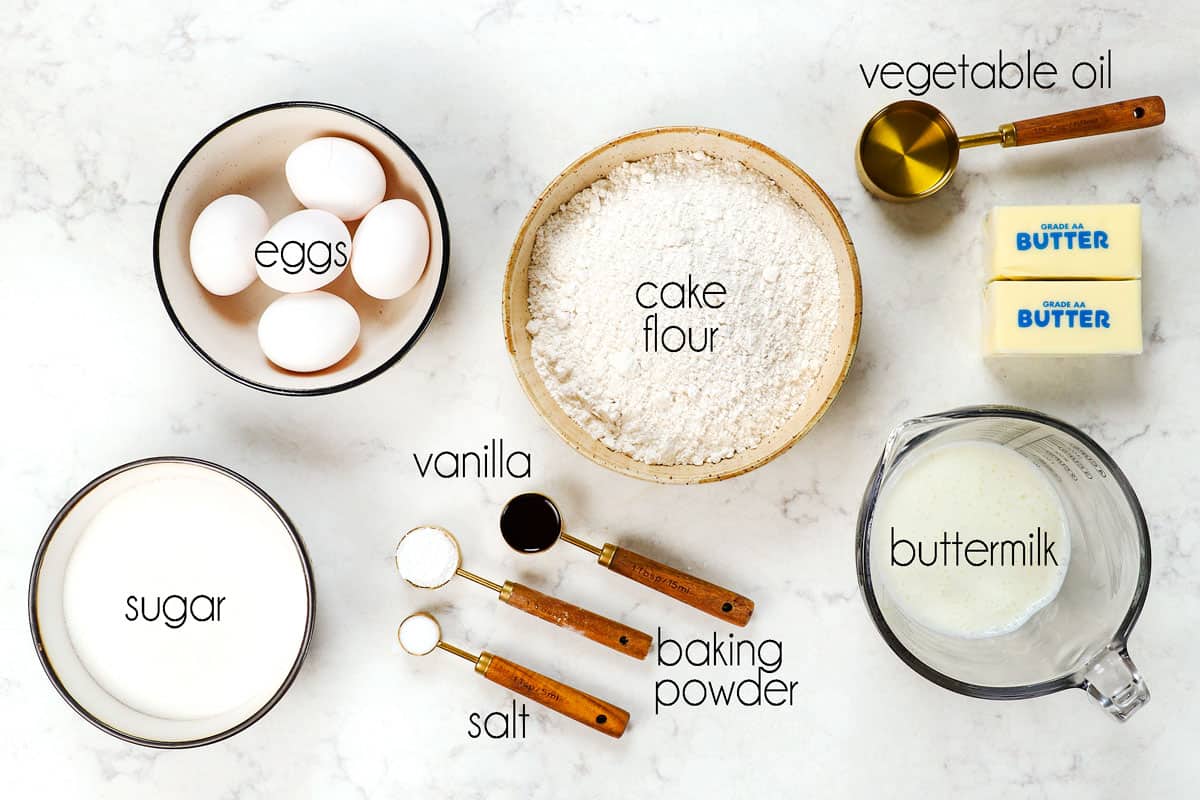 top view showing ingredients for Chantilly Cake: cake flour, eggs, sugar, buttermilk, vanilla and baking powder