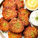 top view showing how to serve potato pancakes on a platter garnished with green onions