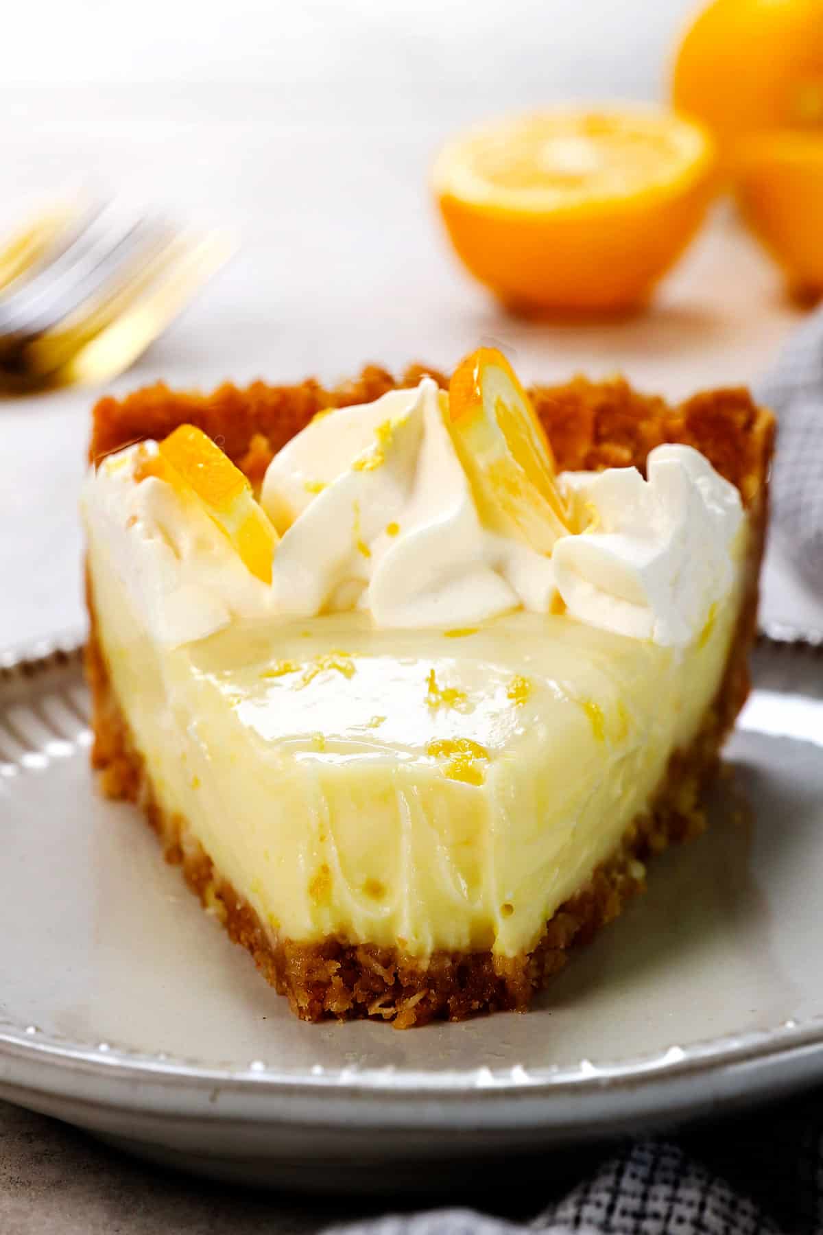 up close of a bite taken out of best lemon pie recipe showing how creamy it is