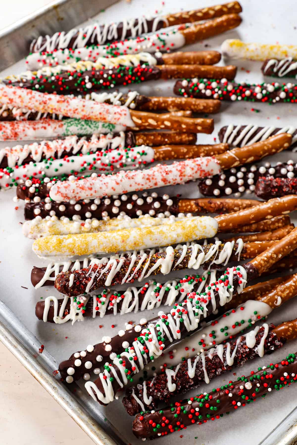 showing chocolate pretzels with various chocolates and sprinkle options on a platter