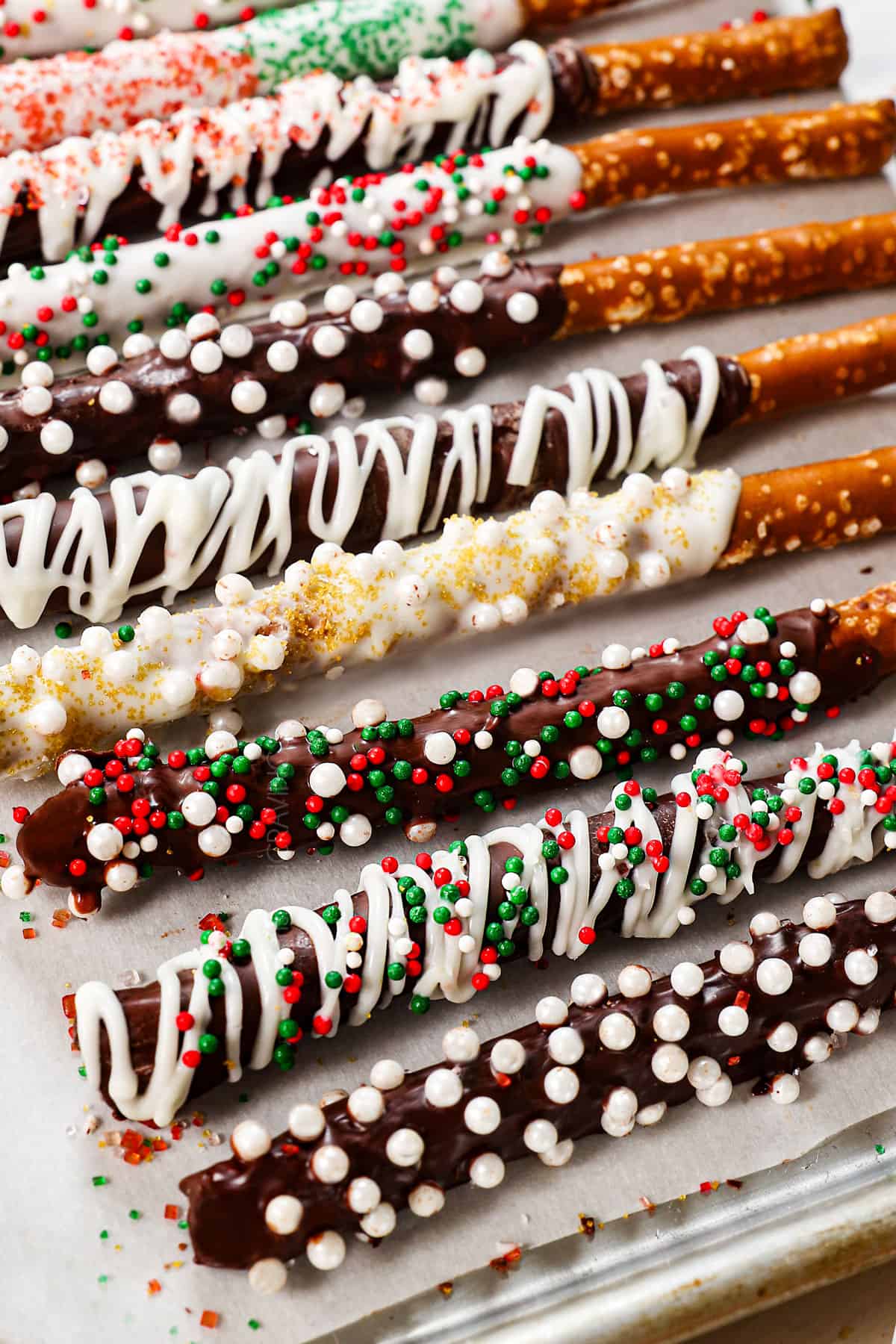 chocolate pretzels lined up with different toppings
