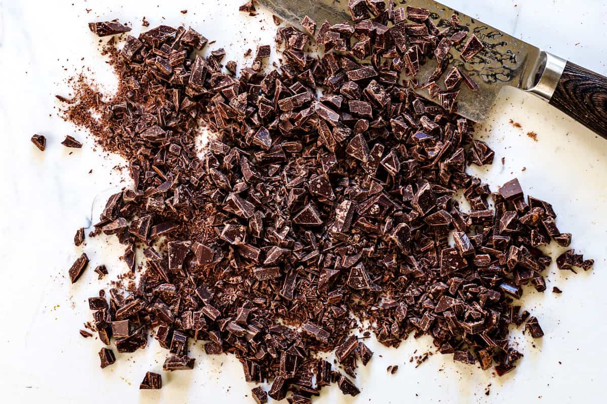 showing how to make chocolate covered pretzels by chopping the semi-sweet chocolate into pieces