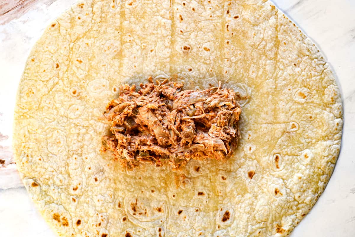 showing how to make chimichangas by adding the filling to the center of a burrito size tortilla