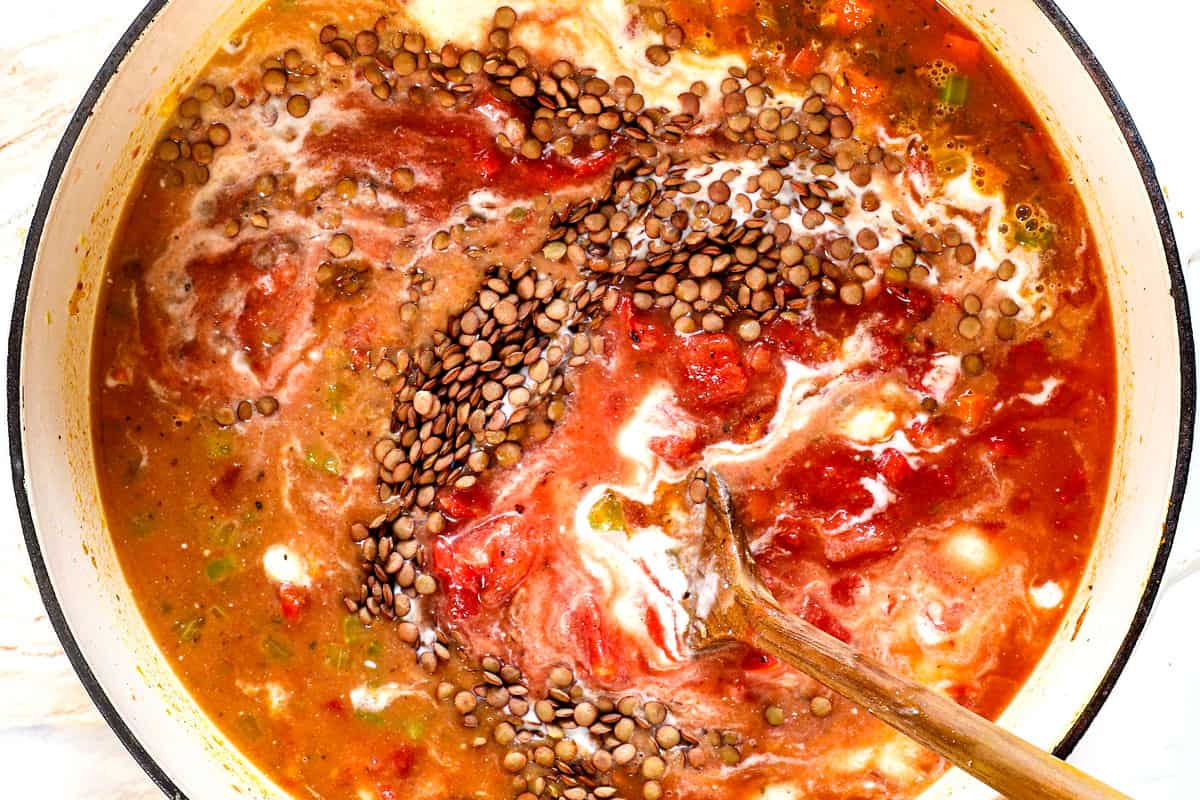 showing how to make lentil soup by stirring in lentils, crushed tomatoes, coconut milk and vegetable broth