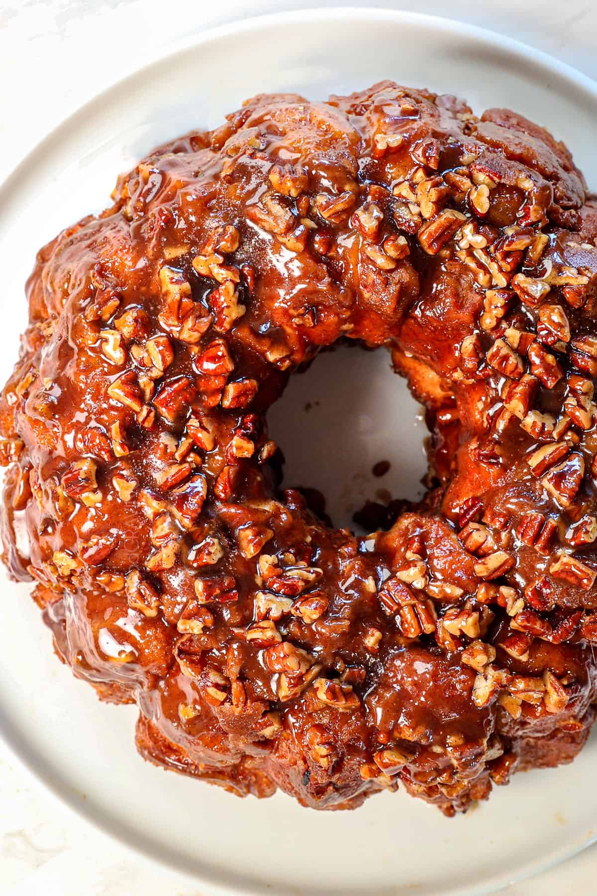 top view of Monkey bread on a platter showing the caramel sauce over top