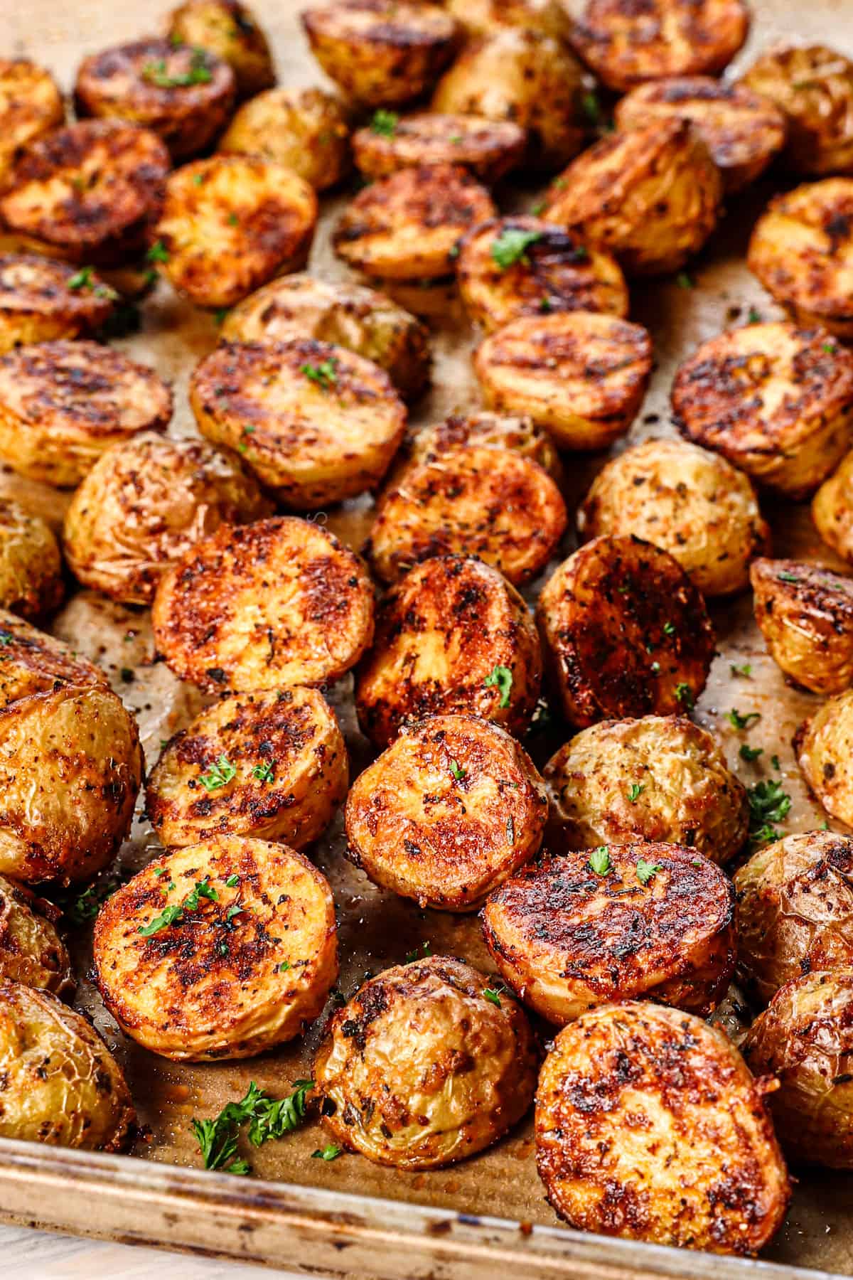 showing how to make roasted potatoes by seasoning with salt and pepper