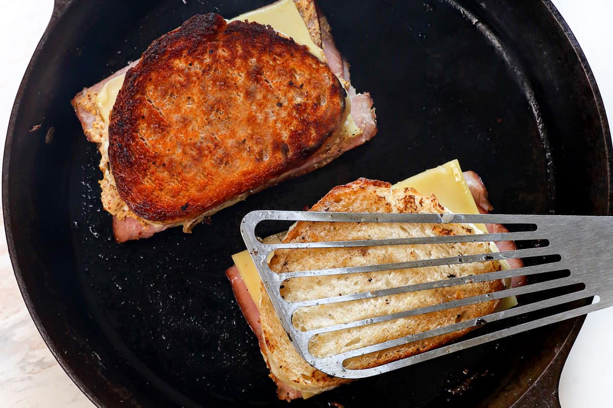 showing how to make croque monsieur by grilling the sandwiches until golden