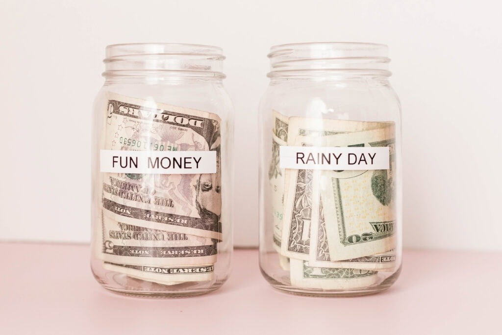 money in jars that say "fun money" and "rainy day". No spend challenge ideas