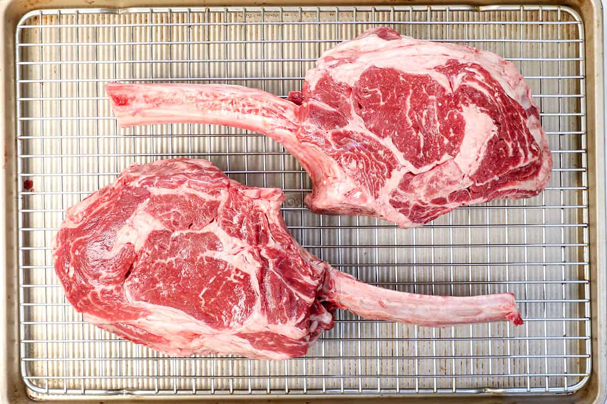 top view of two raw Tomahawk steaks showing what they should look like to buy