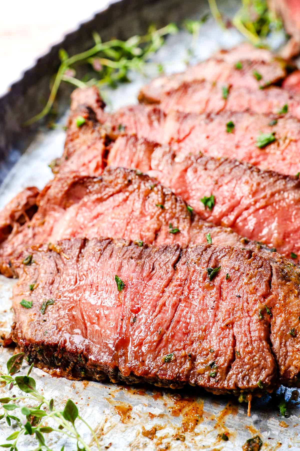 up close of a slice of tomahawk ribeye steak showing juicy it is