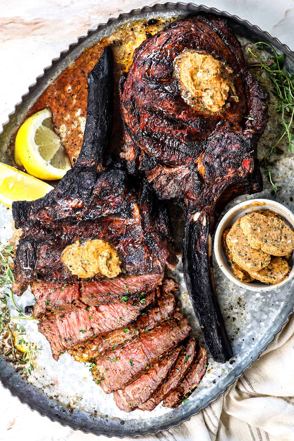 showing how to make tomahawk steak by carving into 1/2-ยพ inch slices
