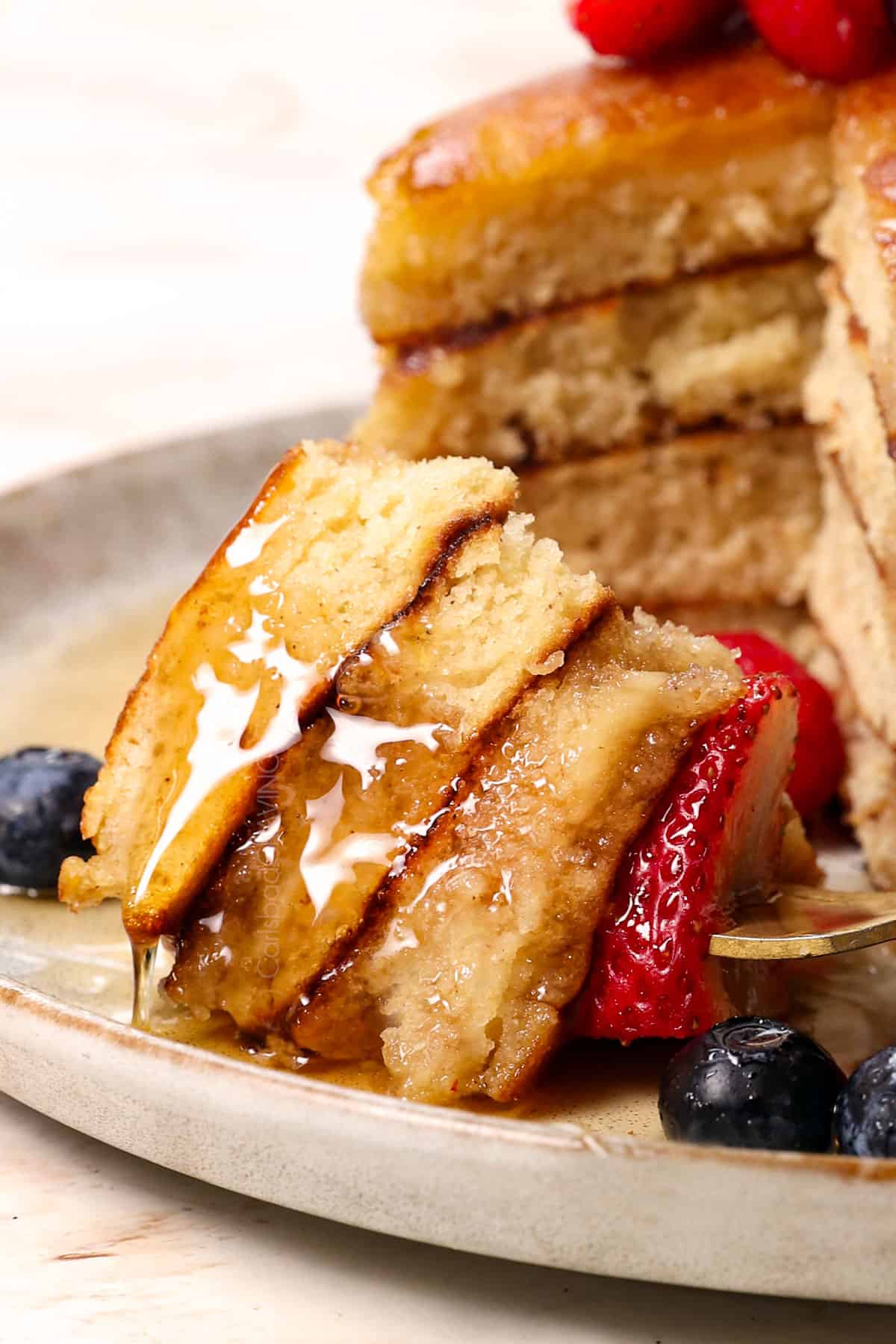 up close of a bite of pancake recipe on a fork showing how fluffy it is
