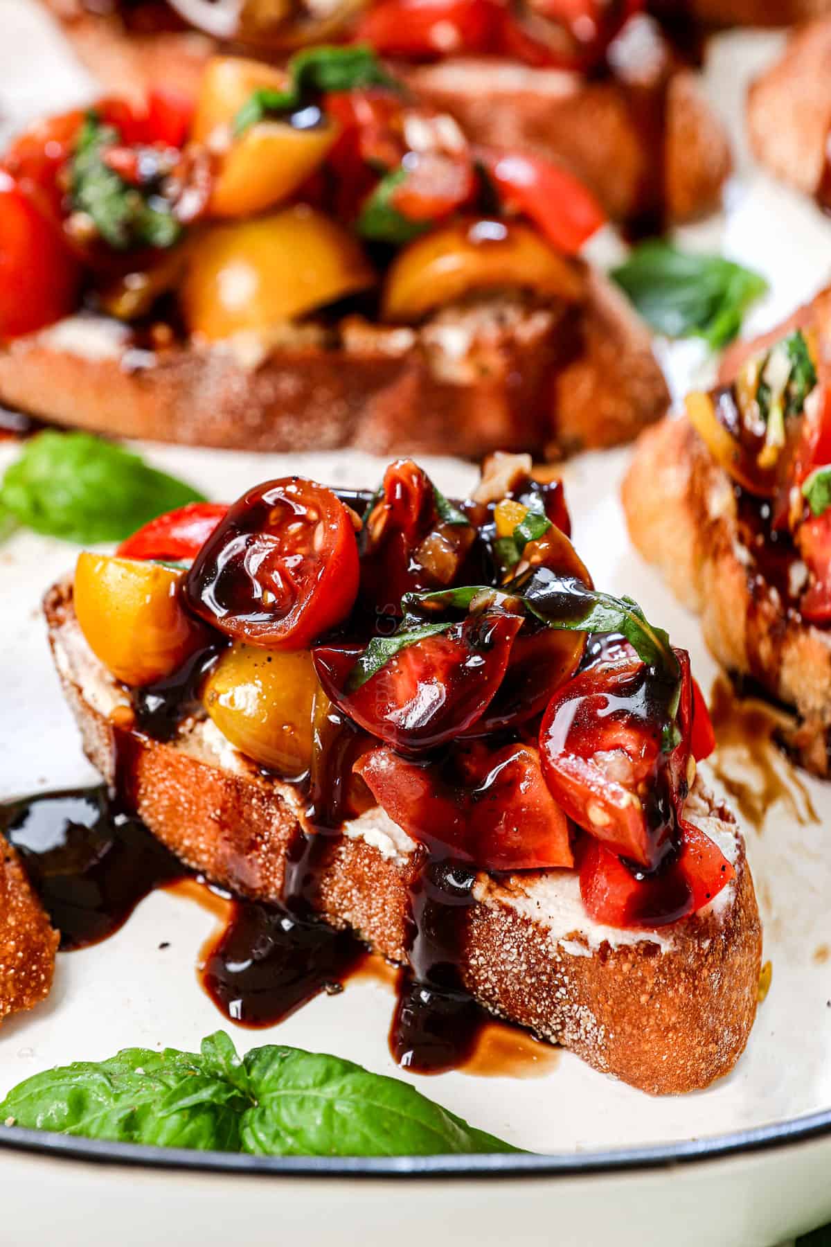 up close of bruschetta drizzled with balsamic glaze