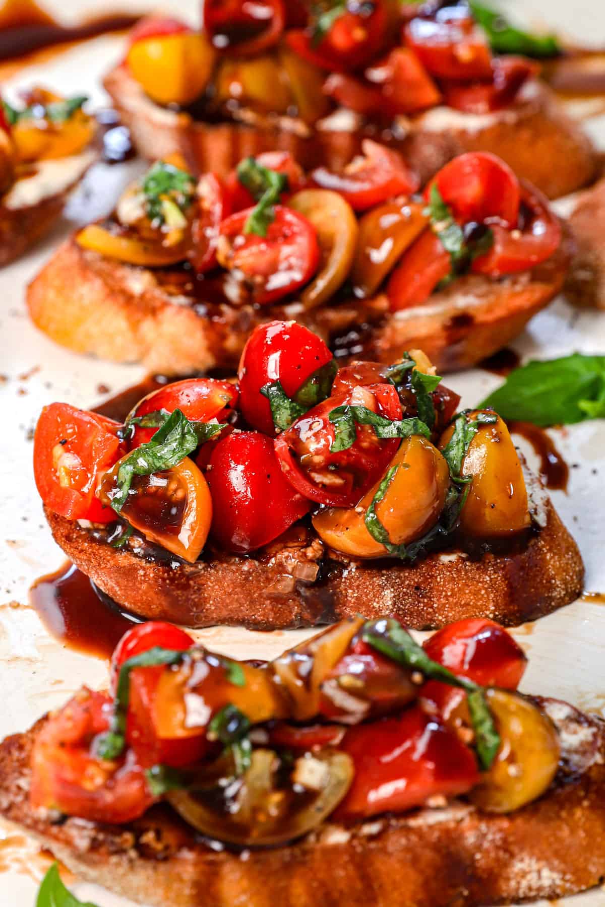 bruschetta recipe lined on a platter showing the variety of tomatoes used