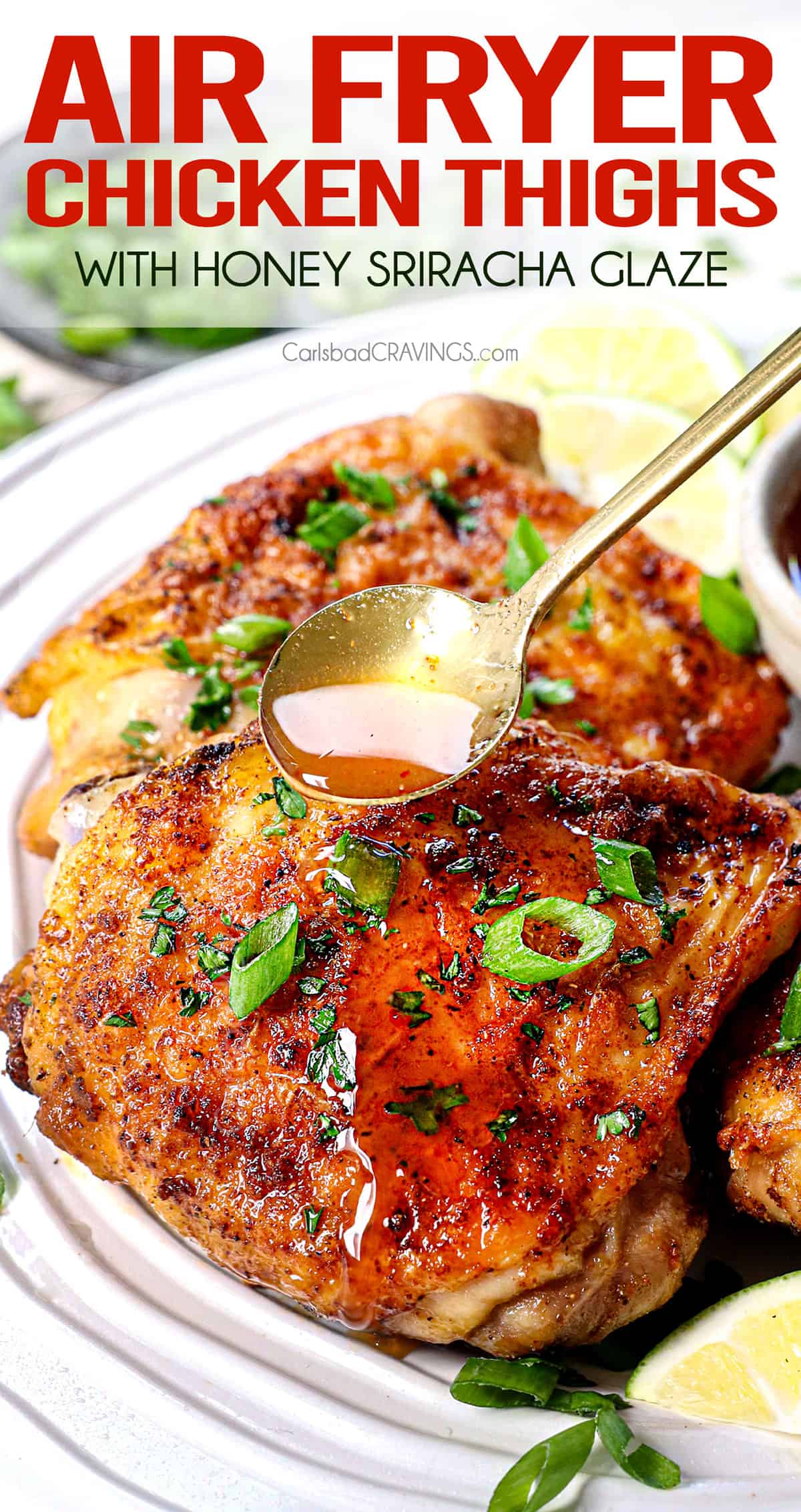 chicken thighs in air fryer with a glaze being drizzled on