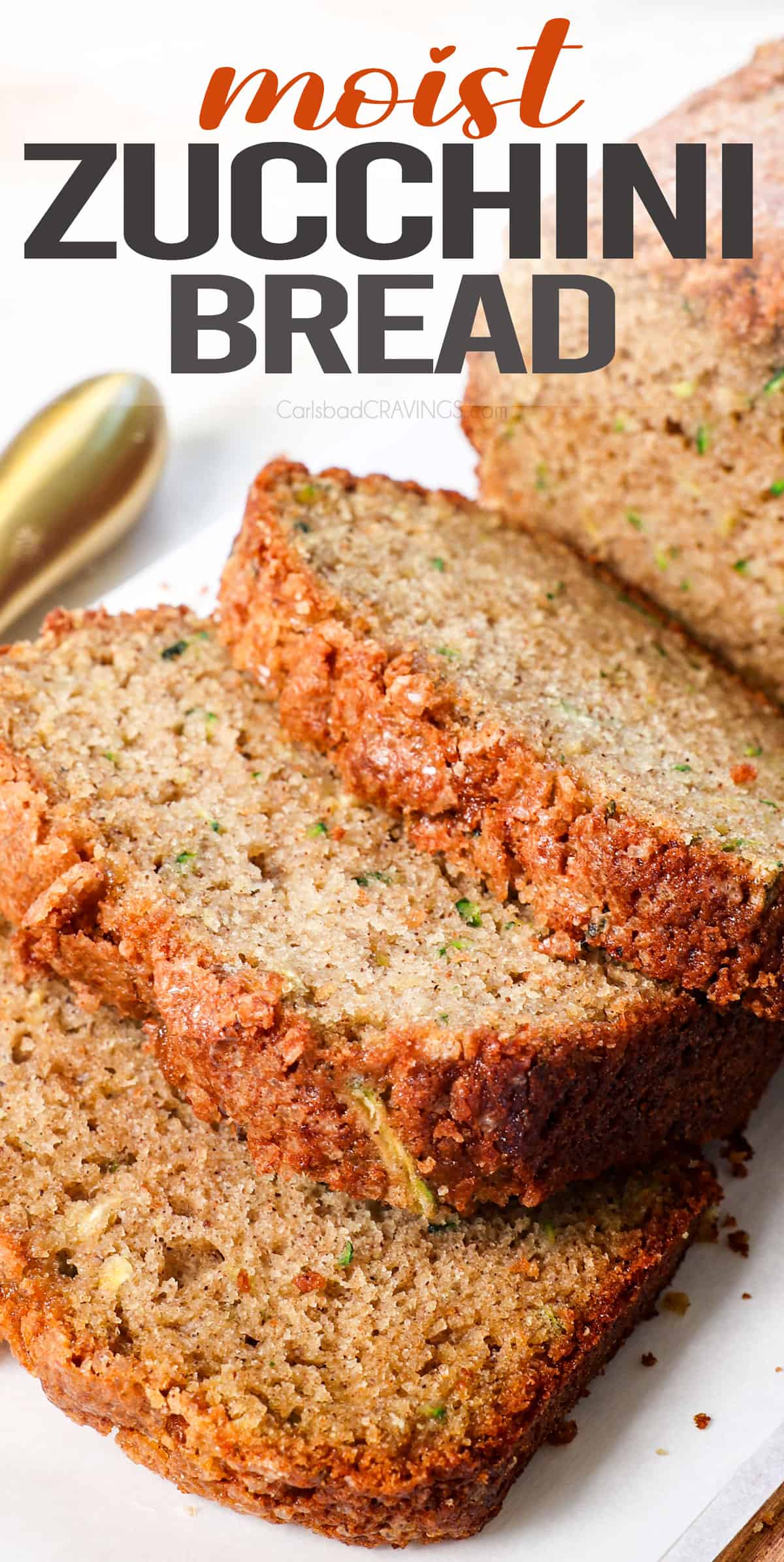 up close of zucchini bread sliced on a cutting board showing how moist it is