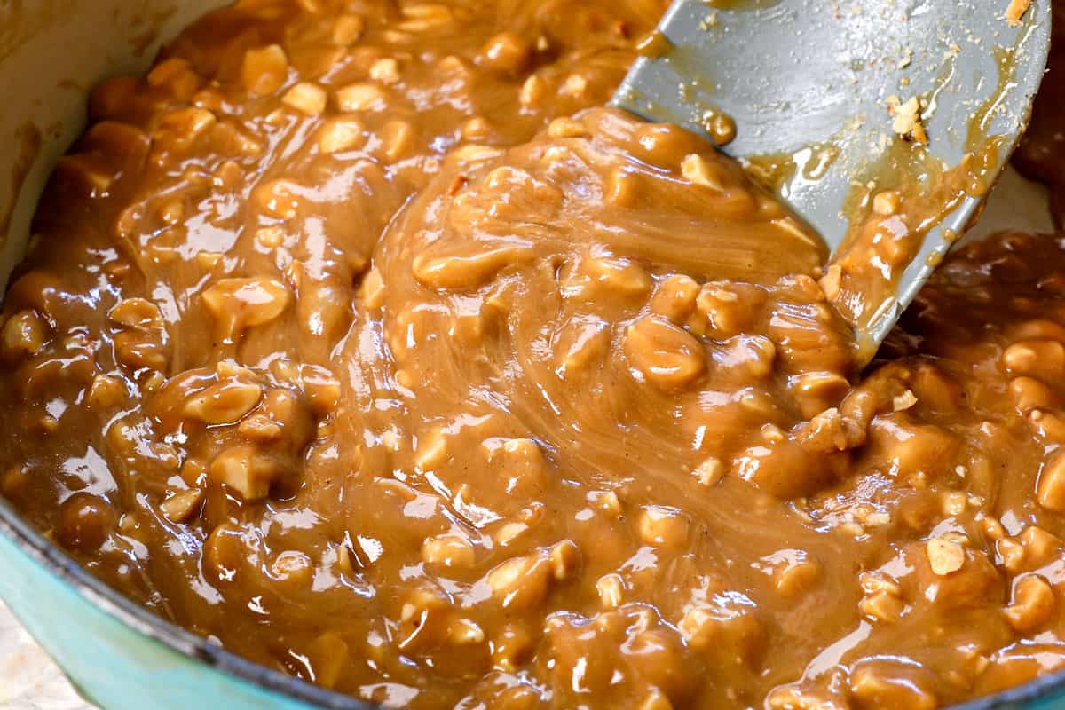 showing how to make ice cream cake by stirring the Peanut Butter Caramel Sauce