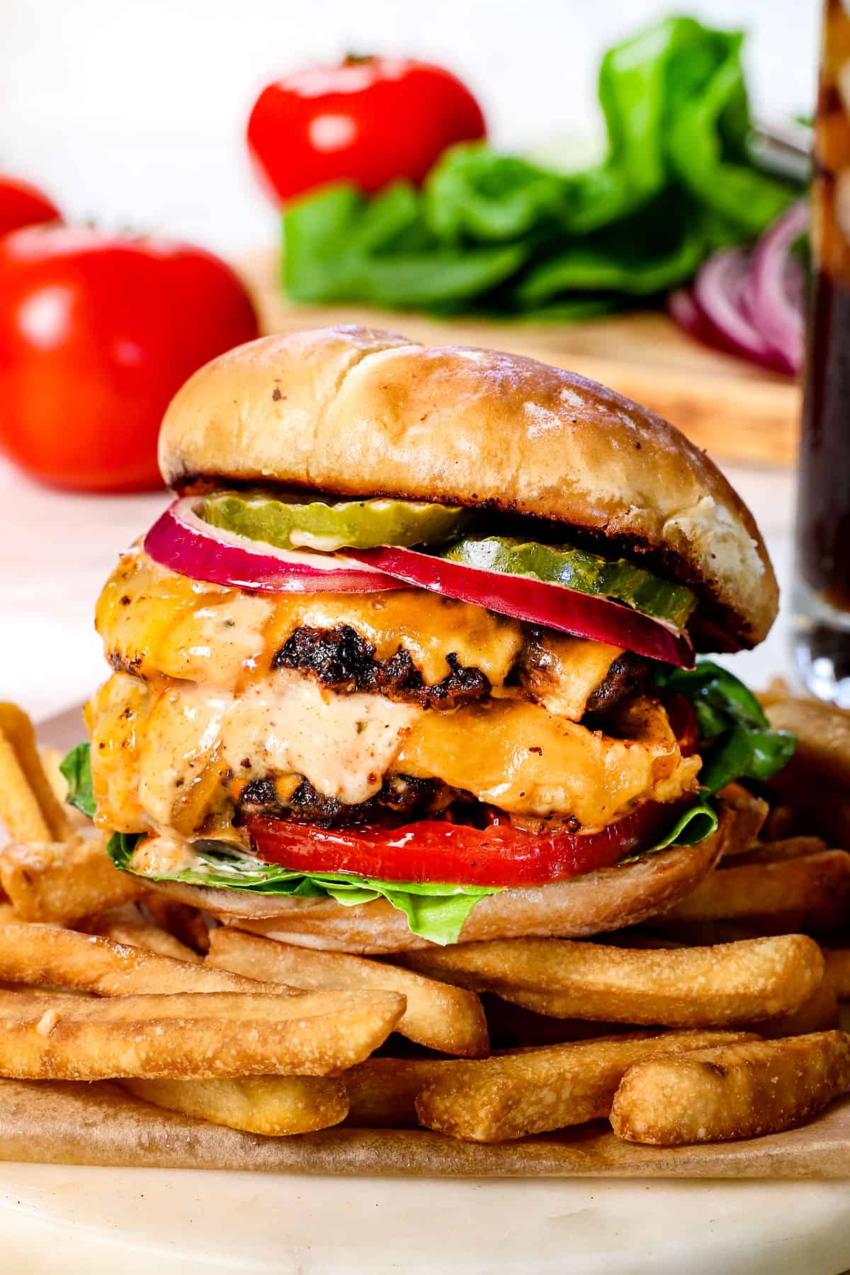 showing how to serve smash burgers with fries