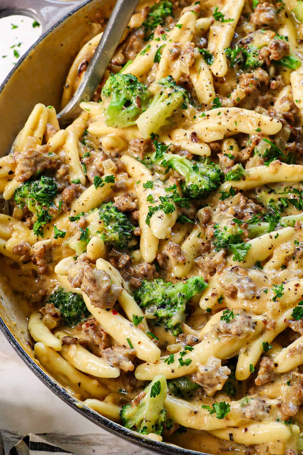 cavatelli recipe in skillet with broccoli and sausage
