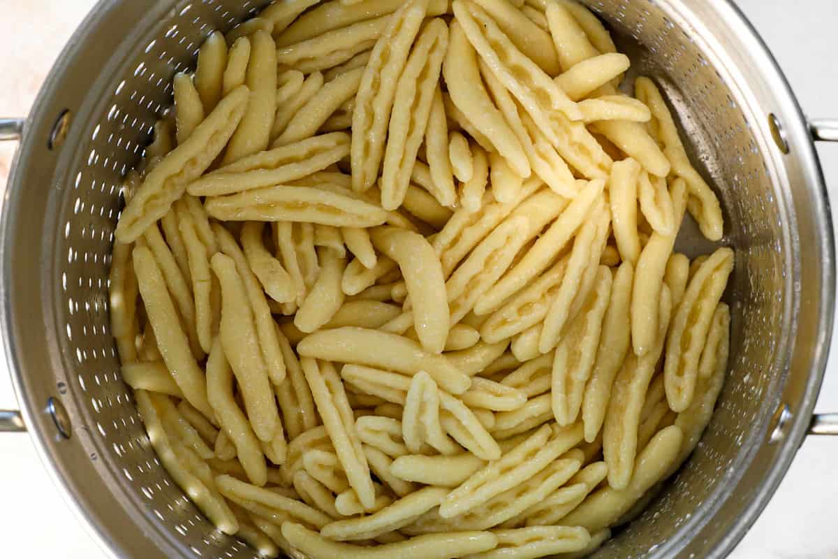 showing how to make cavatelli by boiling it in water