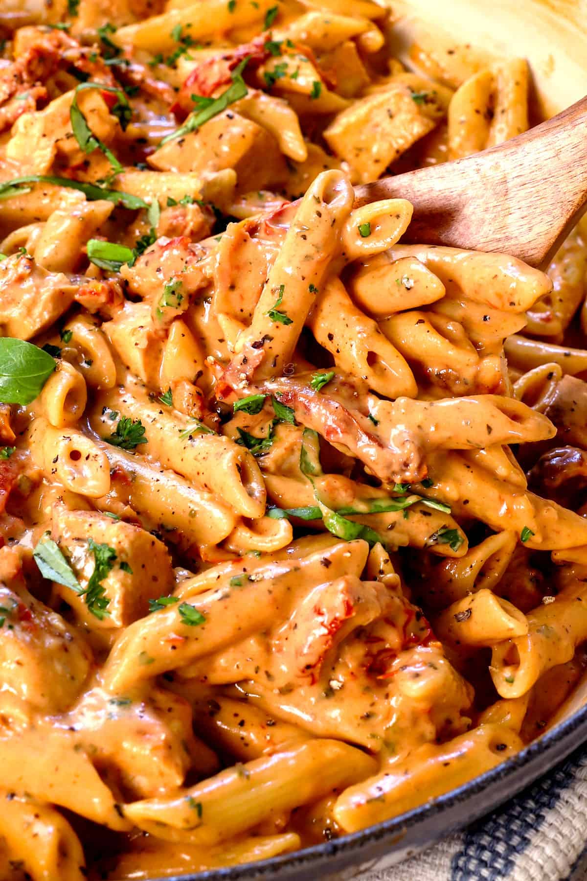 marry me chicken pasta in a skillet showing how creamy it is