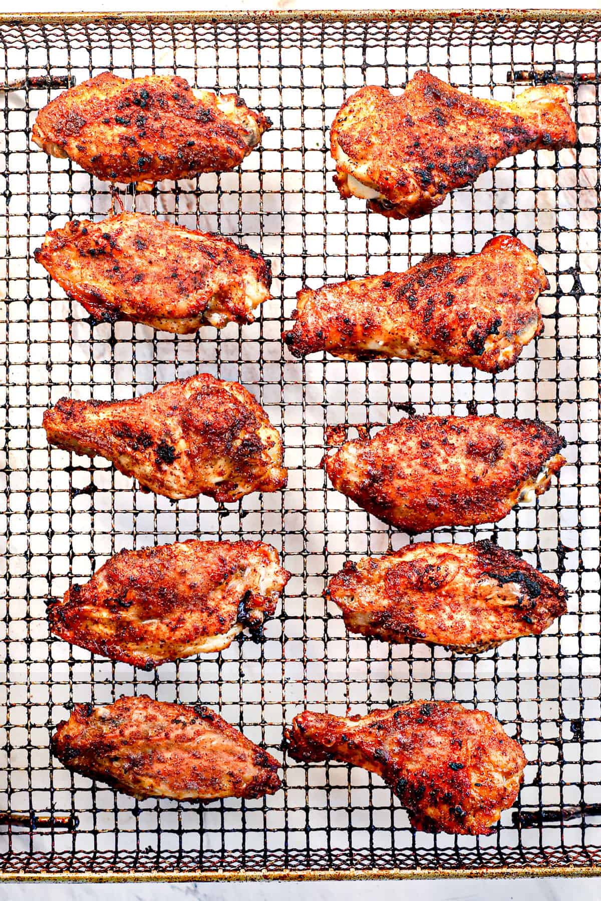 showing how to air fry chicken wings by air frying until crispy