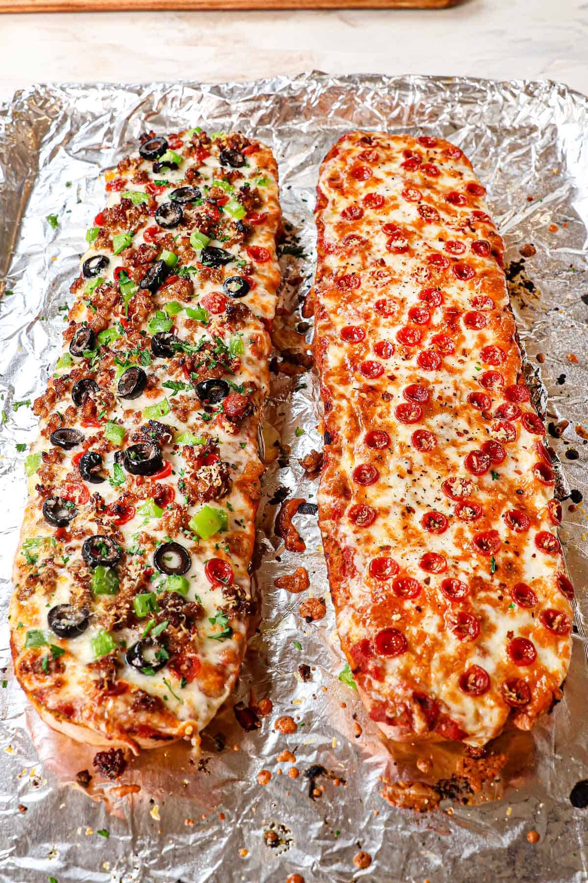 supreme French Bread Pizza and classic French bread pizza with pepperoni being baked on a baking sheet with foil