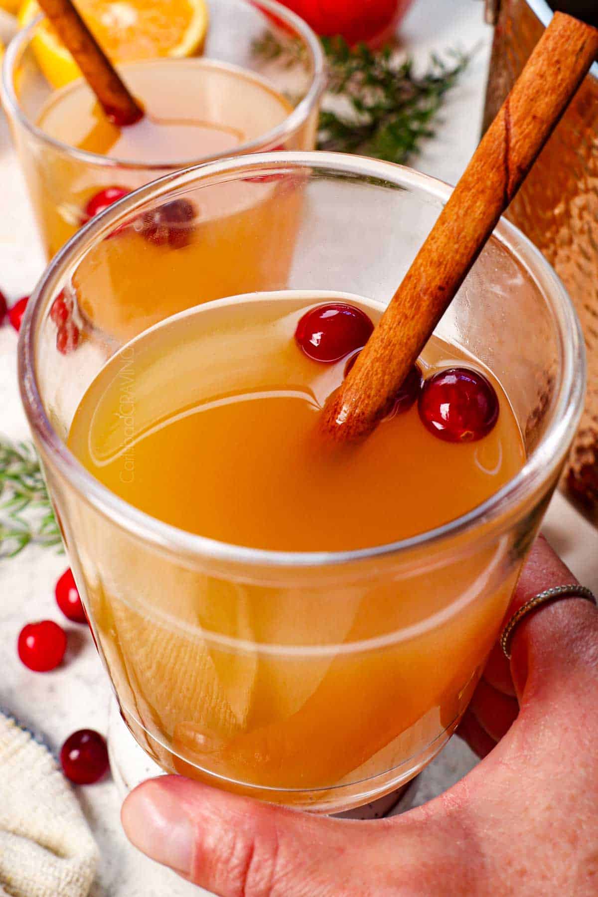 up close holding a glass of wassail