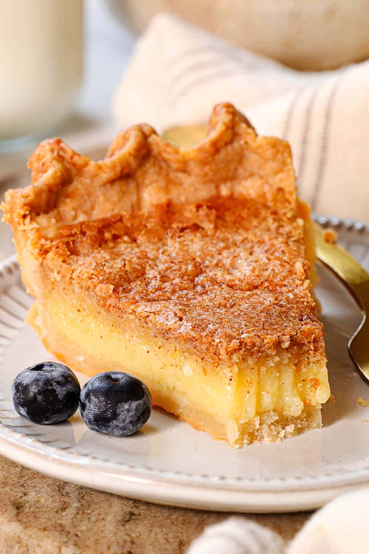 up close of chess pie recipe with a bite taken out showing how creamy it is