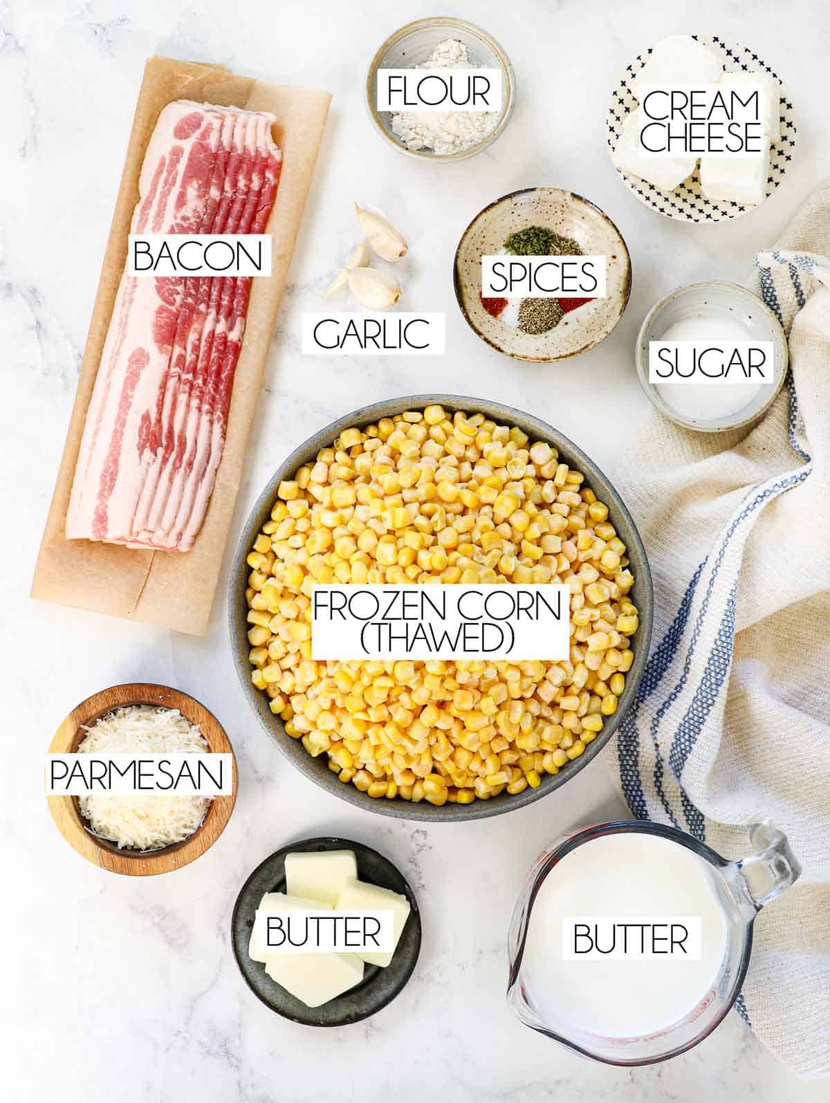 showing how to make creamed corn with top view of ingredients: frozen corn, bacon, shallot, half and half, milk garlic, spices sugar cream cheese, flour
