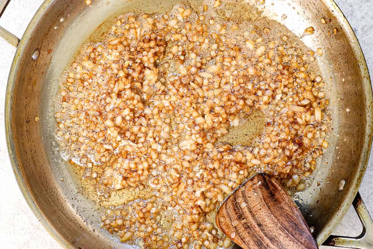 showing how to make creamed corn by sautรฉing the shallots and garlic in bacon grease