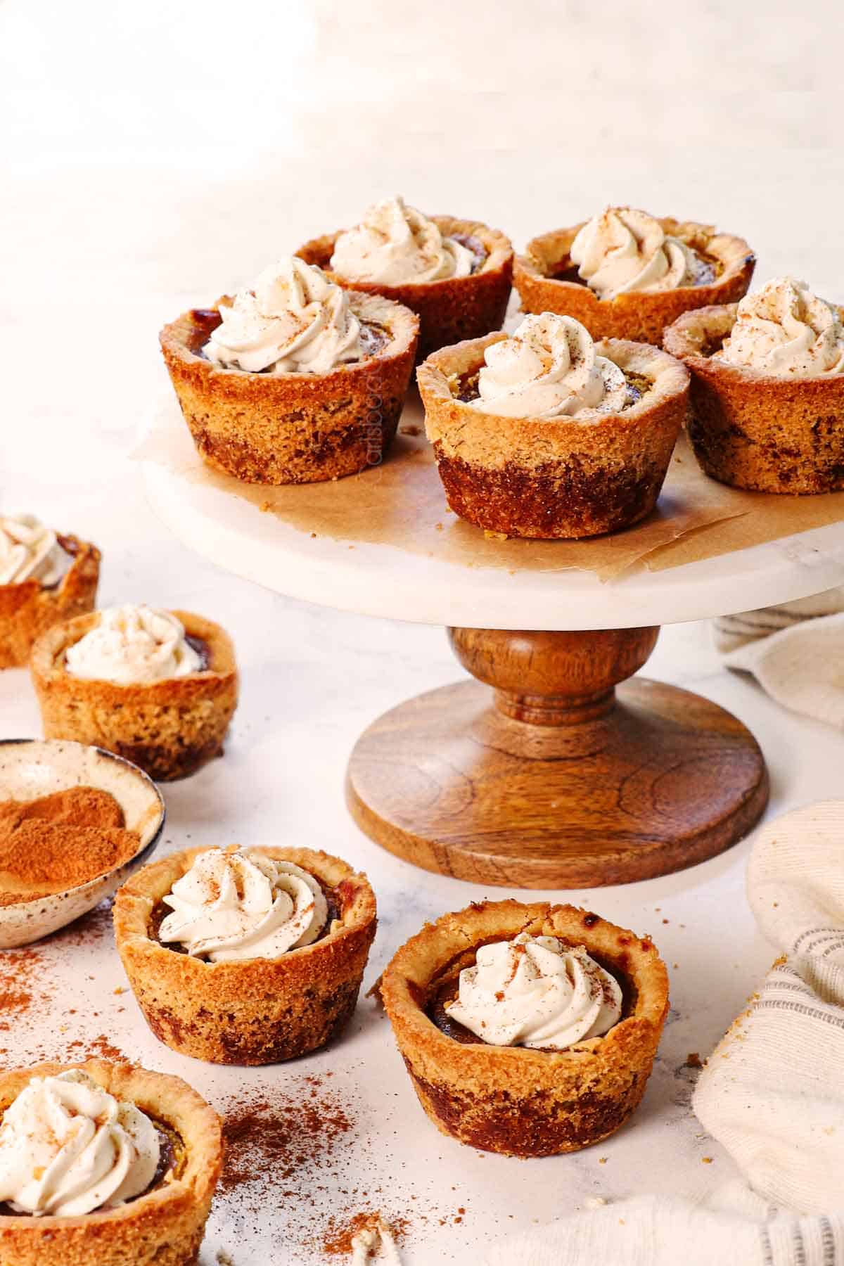 far away shot of how to serve pumpkin pie mini served on a cake stand
