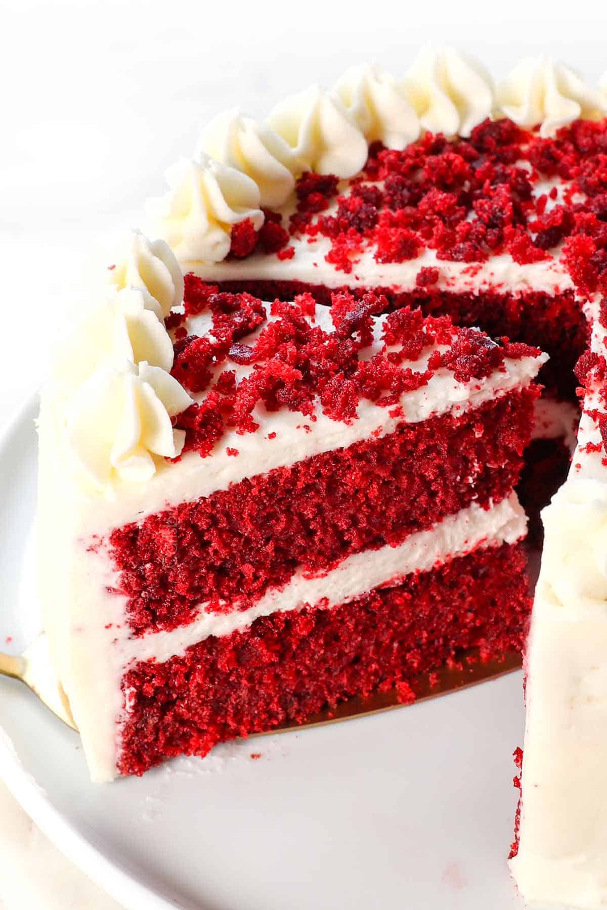 best red velvet cake recipe with a slice cut out