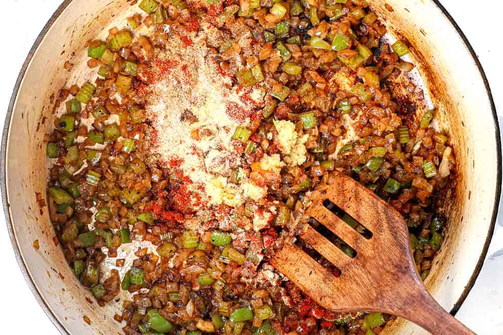 showing how to make red beans and rice by sauteing the bell pepper, onions, celery, garlic and spices